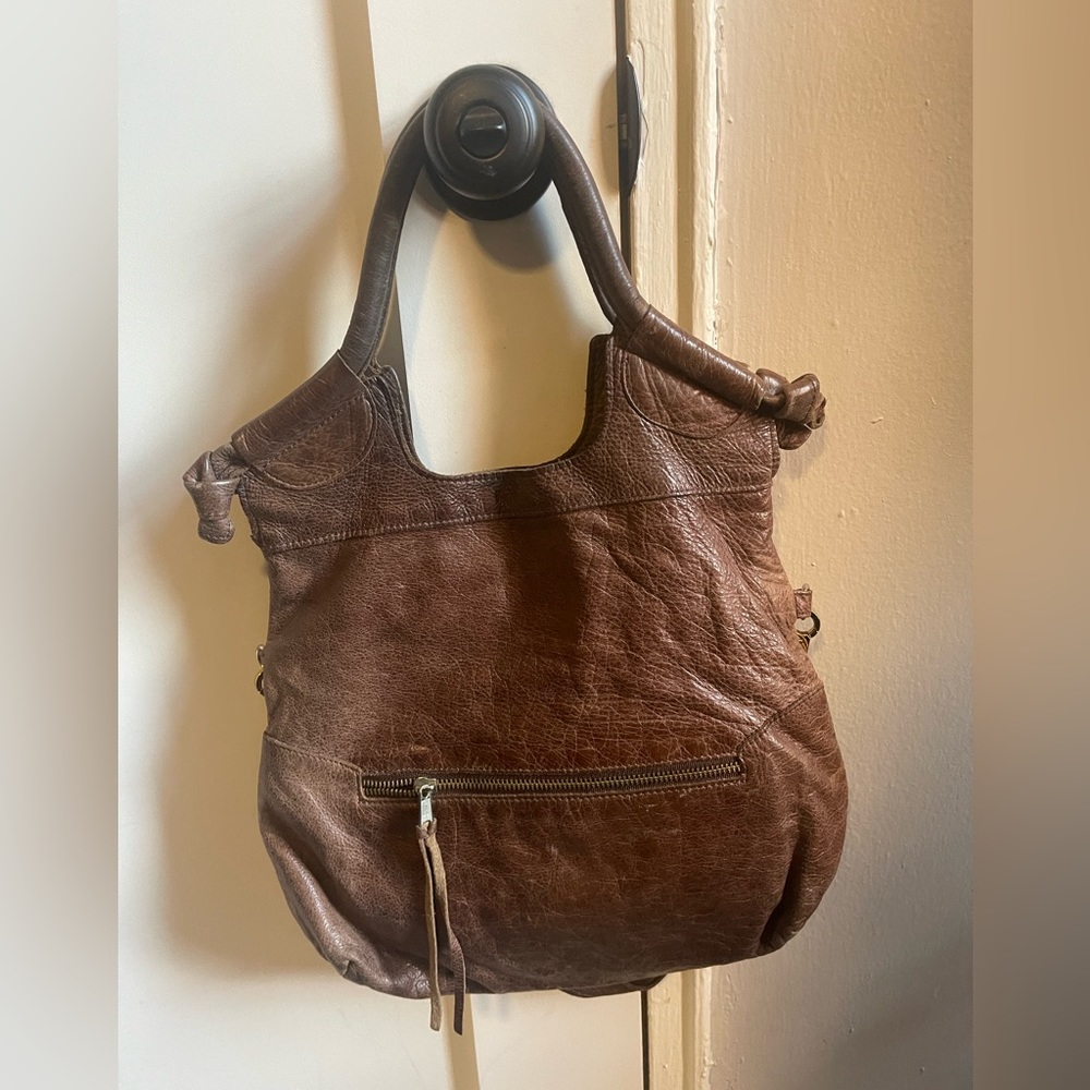 Medium size bag. Have so much life left. Selling bc I have it in black too.